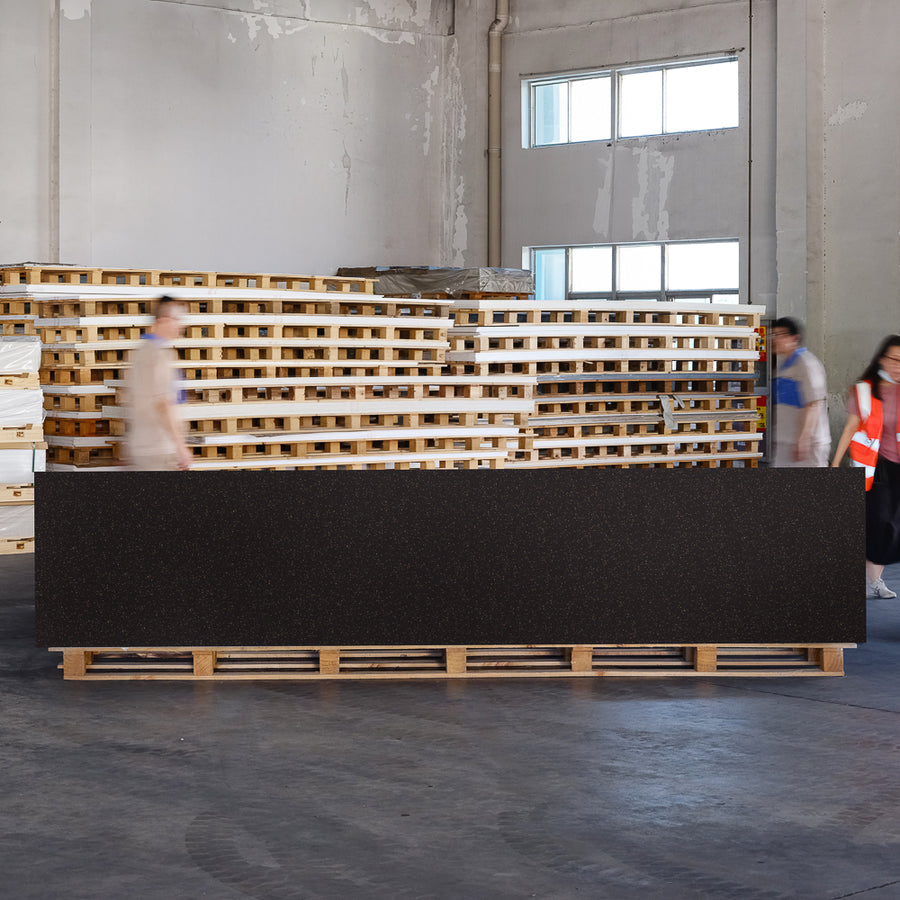 Full size Dawson Black solid surface panel in a warm black tone with fine walnut shell and bamboo fibre speckling.